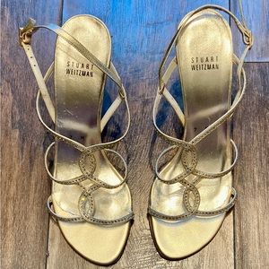 Stuart Weitzman Gold Strappy Sandals with Crystal Accents.